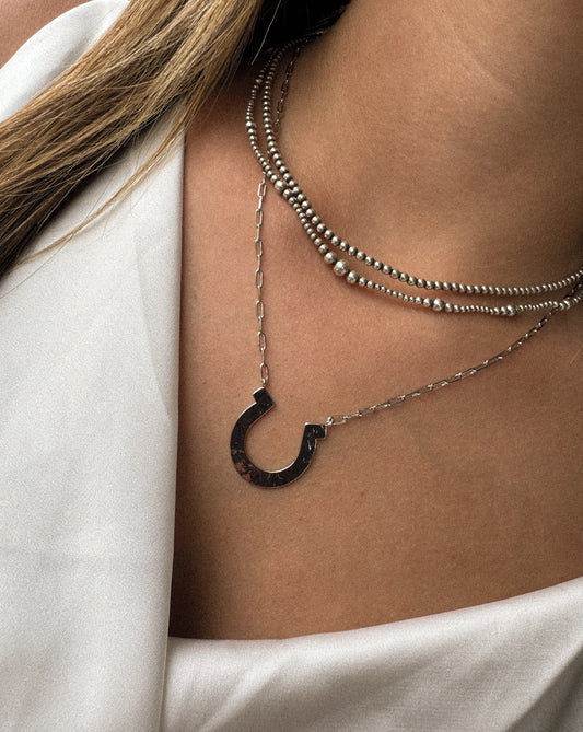 Pendant necklace on a 17.5-inch chain, close-up of the pendant — the Regan by Saddle & Stone